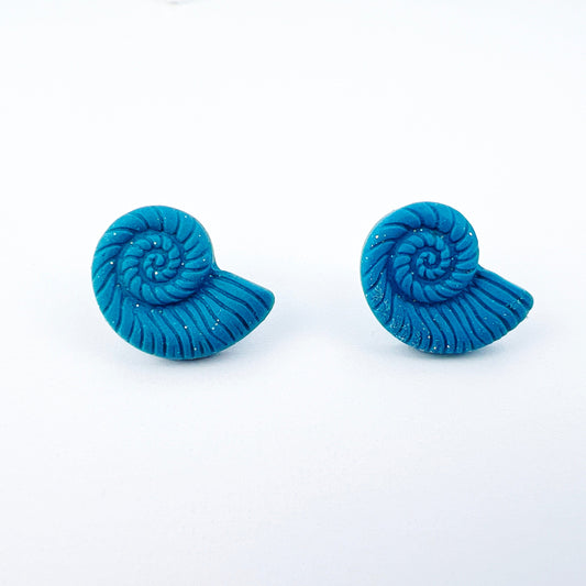 Front view of aair of handcrafted conch shell stud earrings featuring a polished, ocean-inspired design; lightweight, perfect for sensitive ears, and ideal for daily wear.