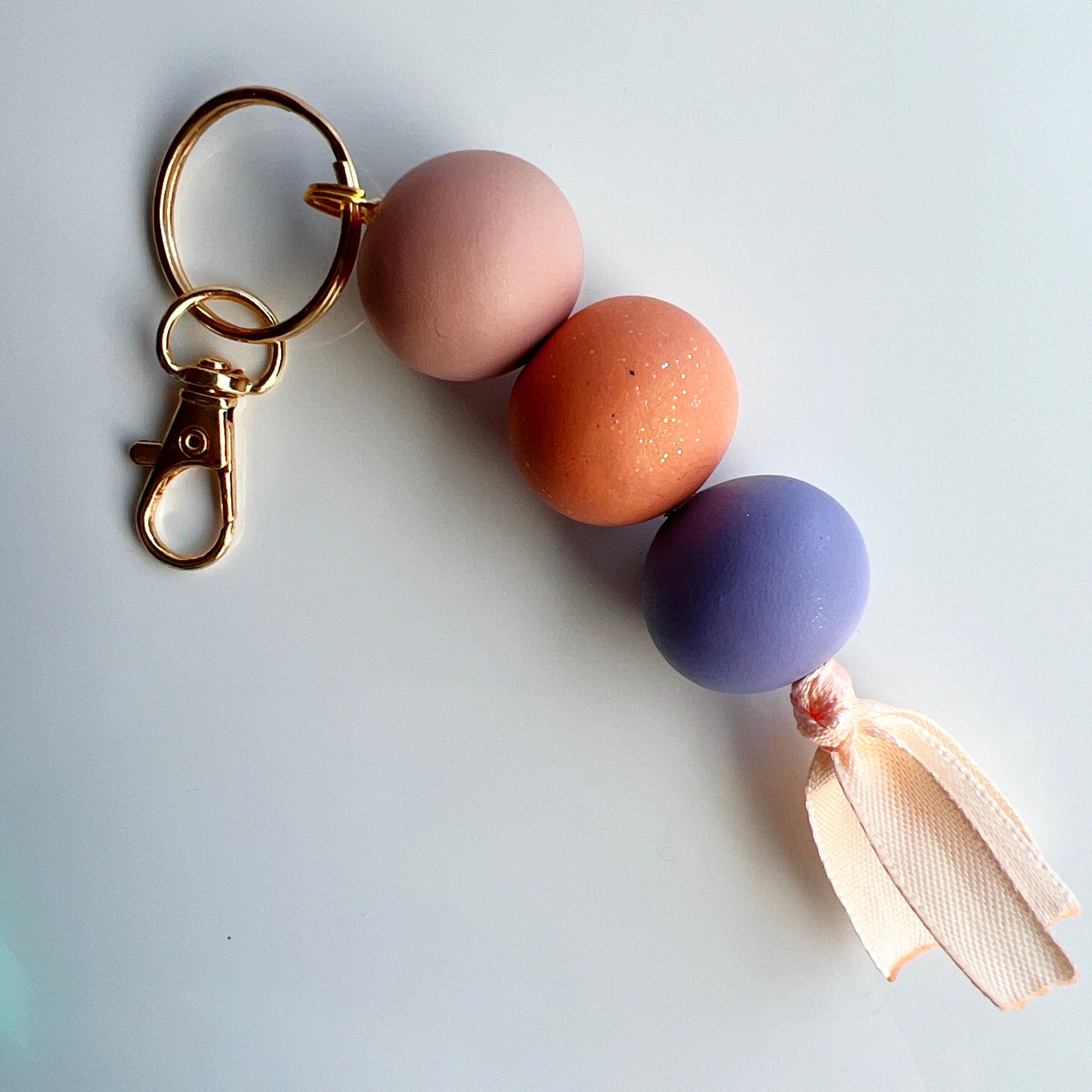 Keychains Tan - Light Orange - Periwinkle Beaded Clay Keychain with Ribbon, Lobster Claw, Swivel Hook